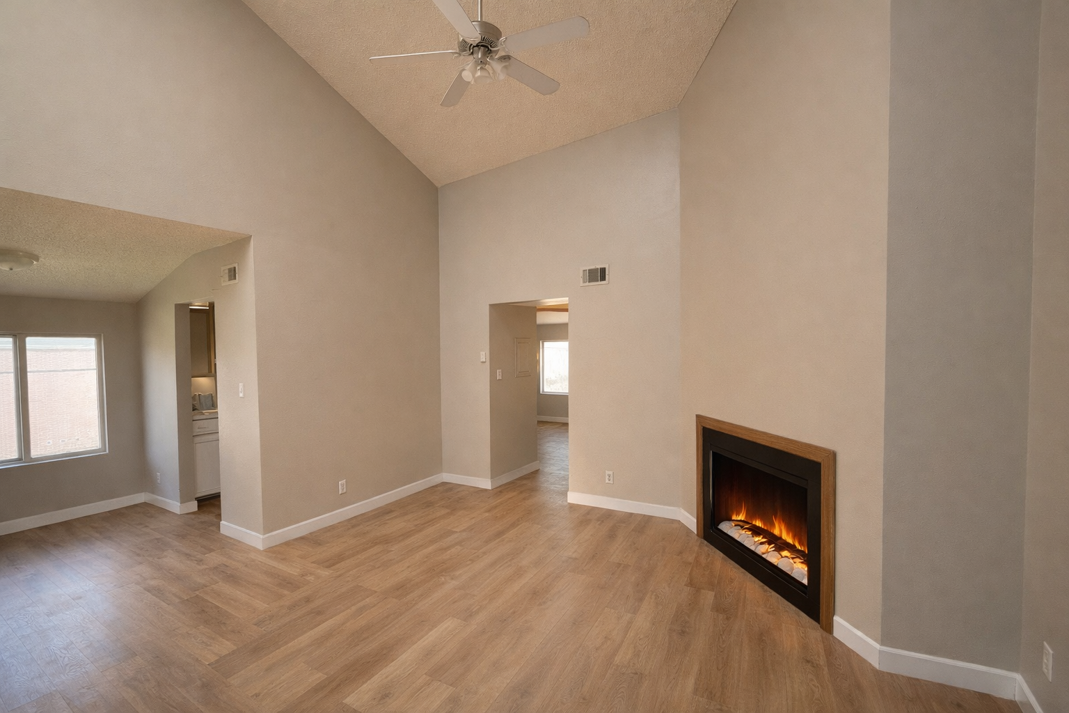 Vaulted-ceiling living room with new fireplace